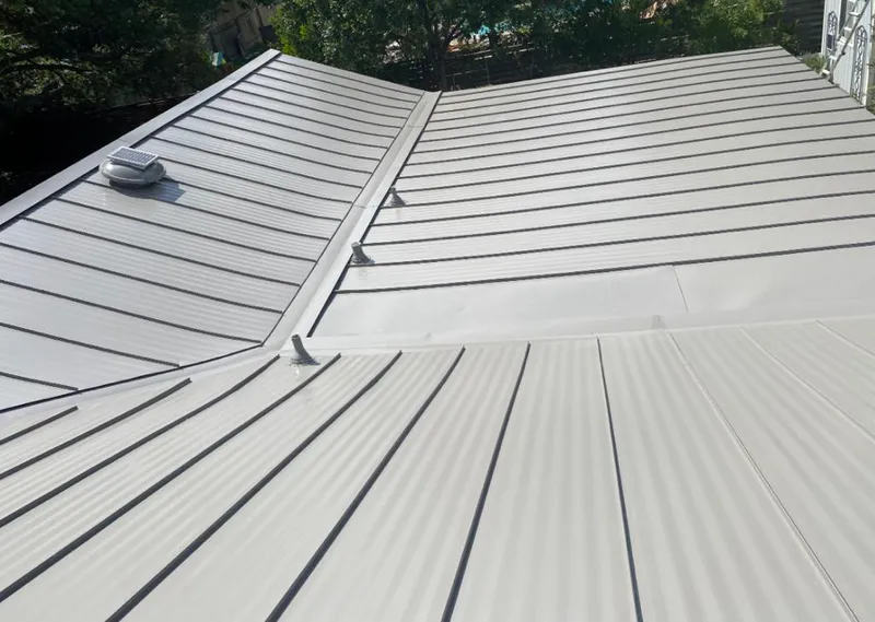 Solar attic fan installed on a metal roof for Roof Ventilation in Big Spring